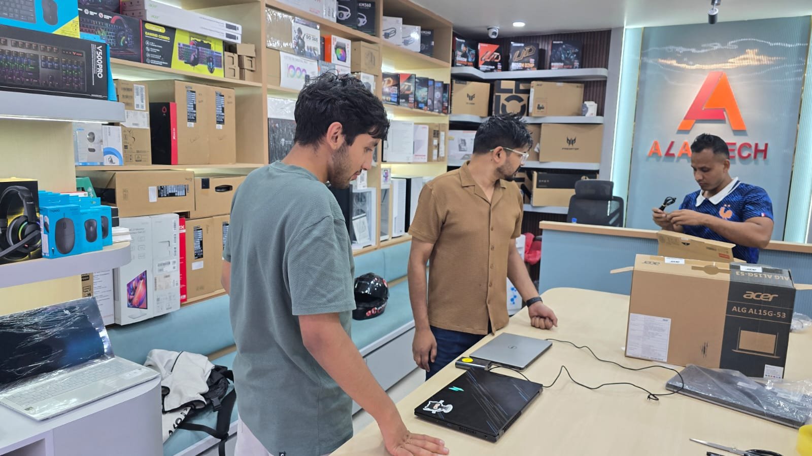 Technician inspecting an old laptop before calculating its exchange value
